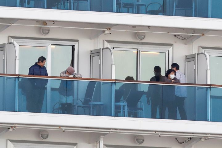 Passengers are seen in their cabins on the cruise ship Diamond Princess at Daikoku Pier Cruise Terminal in Yokohama, Japan February 7, 2020.