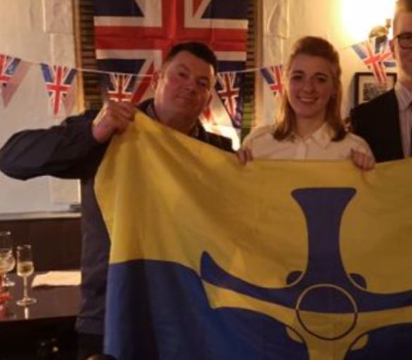 Dehenna Davison and Andrew Foster with a County Durham flag at a party celebrating Britain's exit from the EU