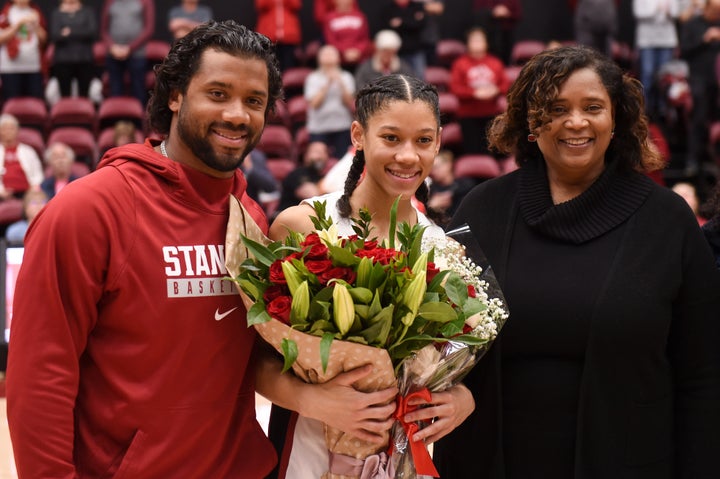 Seattle Seahawks quarterback Russell Wilson joins his younger sister Anna Wilson #3 of the Stanford Cardinal to celebrate Senior Day with mother Tammy Wilson on February 9, 2020, in Palo Alto, California.