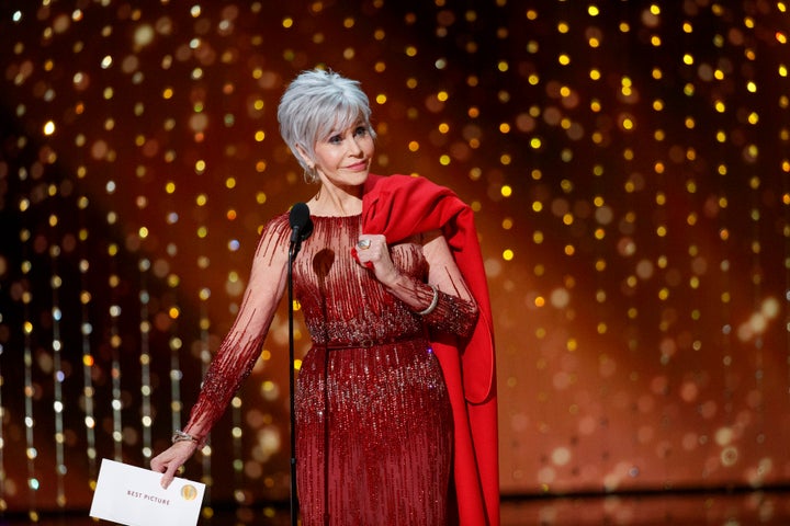 Jane Fonda turned up at the 2020 Oscars in a gown by Elie Saab. She carried the coat in which she's been arrested five times during climate change protests. 