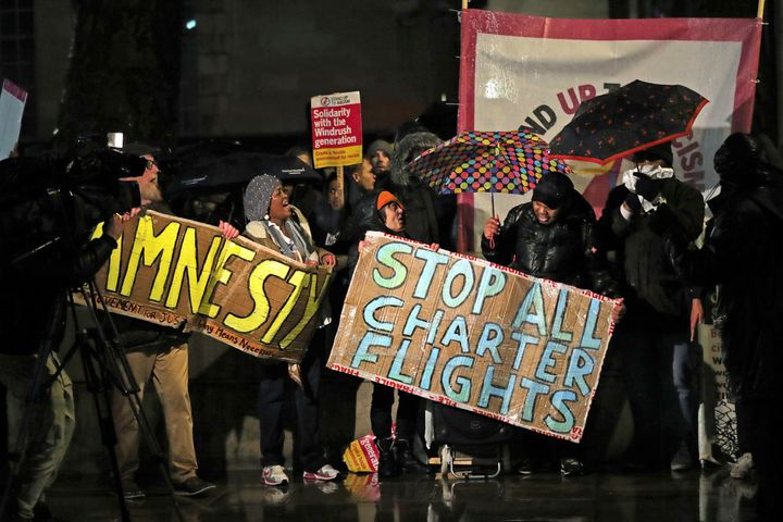 Campaigners chant slogans outside Downing Street as they protest against government plans to deport 50 people to Jamaica