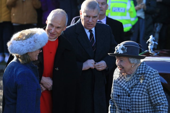 The Duke of York accompanies Queen Elizabeth II as she arrives for a church service at St Mary the Virgin Church in Norfolk, eastern England, on Jan. 19.