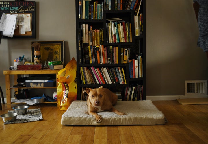 Merry relaxes on her bed at her home in Arvada on Feb. 6.