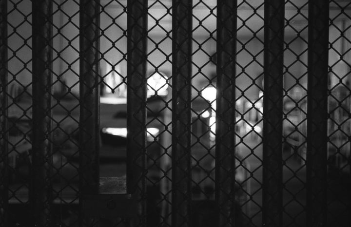 View through prison bars of dormitory bunks at Mississippi State Penitentiary (or Parchman Farm), Mississippi, 1964. Since it