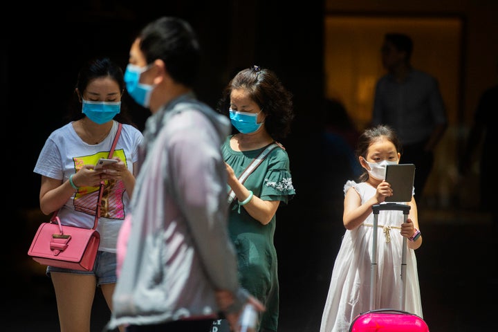 People in Sydney's CBD are seen wearing masks on January 31.