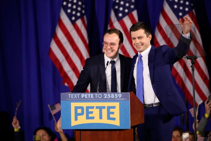 Former South Bend, Indiana Mayor Pete Buttigieg, right, celebrates with his husband, Chasten, at an election night party in New Hampshire.