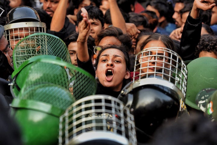 Delhi Police personnel and demonstrators during the march to Parliament near Jamia Millia Islamia, on February 10, 2020 in New Delhi.