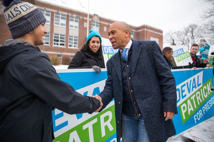 Former Massachusetts Gov. Deval Patrick, shown here shaking hands with voters in Manchester, New Hampshire, as Tuesday's primary was underway in the state, on Wednesday joined the ranks of dropouts in the race for the Democratic presidential nomination.