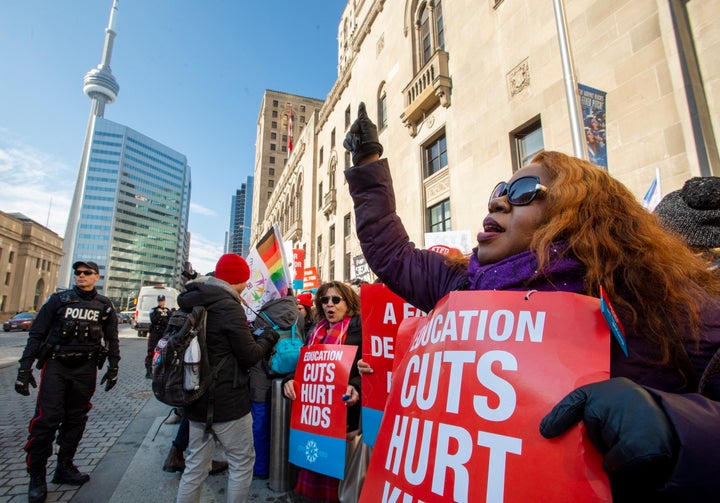 Striking school teachers protest outside a speech by Ontario Education Minister Stephen Lecce in Toronto on Feb. 12, 2020.