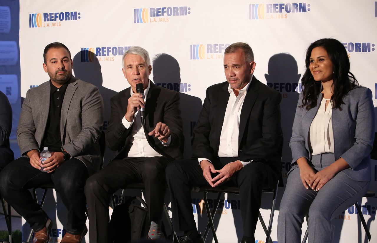 Progressive district attorney candidates George Gascón (second to left) and Rachel Rossi (far right) participate in a summit on reforming the Los Angeles County jail system.