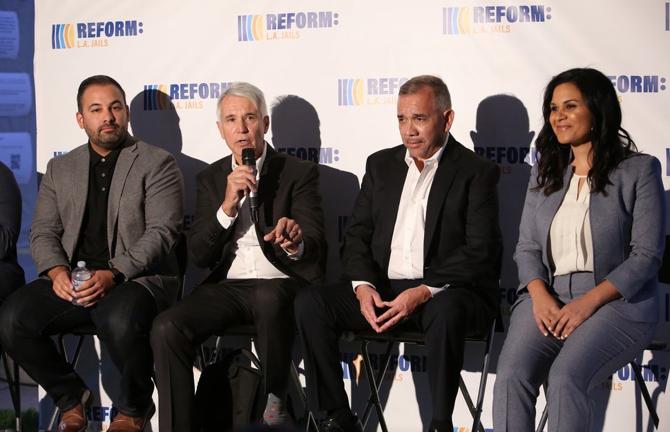 Progressive district attorney candidates George Gascón (second to left) and Rachel Rossi (far right) participate in a