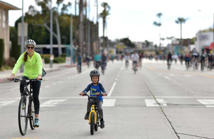 Riding bicycles during a community car-free day.