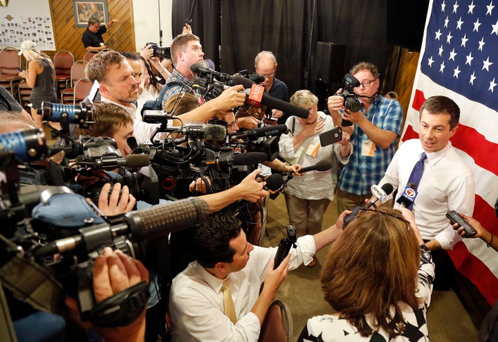 Democratic presidential candidate Pete Buttigieg speaks to the media following a Veteran's and Mental Health Town Hall event at an American Legion Hall, Friday, Aug. 23, 2019, in Manchester, N.H. (AP Photo/Mary Schwalm)