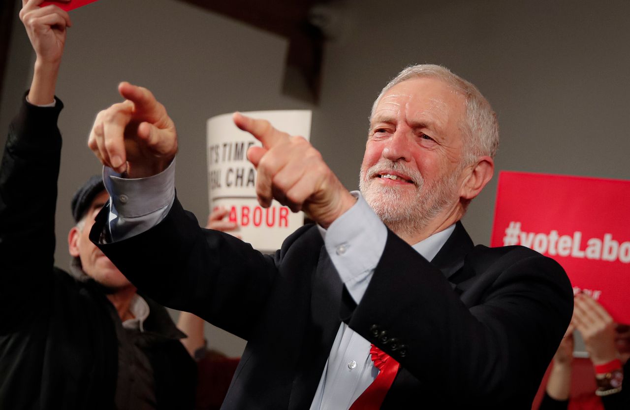 Labour Leader Jeremy Corbyn points his fingers at the end of an eve of poll rally in London, Wednesday, Dec. 11, 2019. 