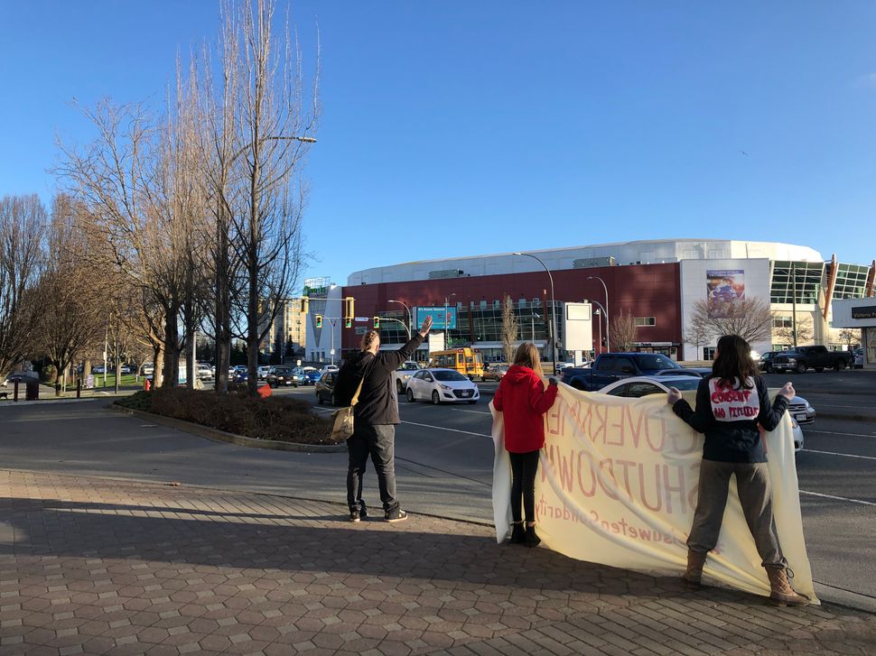 Allies of the Wet'suwet'en hereditary chiefs picket outside government buildings in Victoria, B.C. on Feb. 14, 2020. 