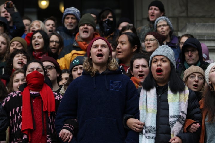 Supporters of Wet'suwet'en hereditary chiefs block the entrance to the library at legislature before the throne speech in Victoria, B.C., on Feb. 11, 2020.