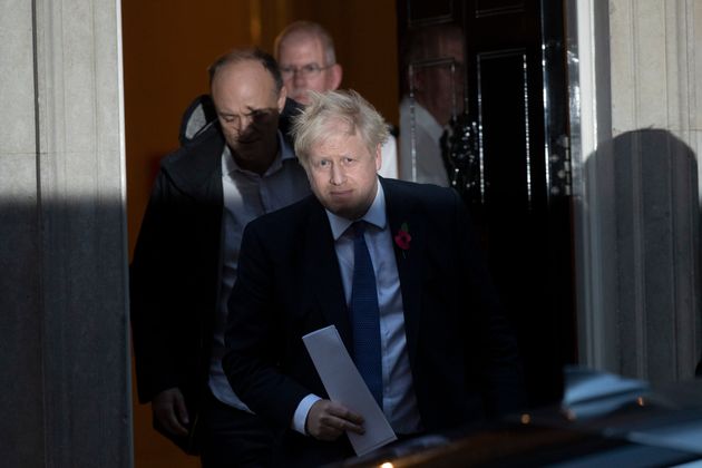 Boris Johnson and his advisor Dominic Cummings, left, leave 10 Downing Street 