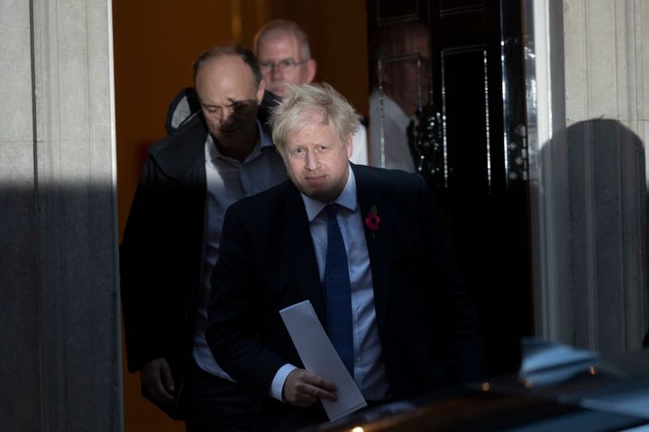 Boris Johnson and his advisor Dominic Cummings, left, leave 10 Downing Street 