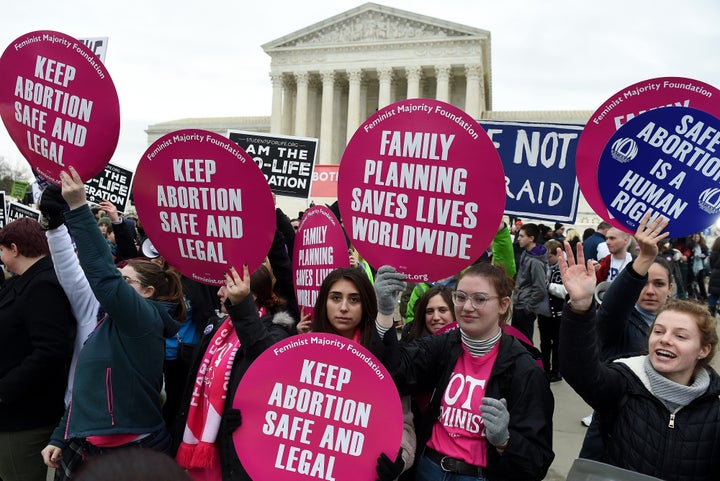 Anti-abortion and abortion rights activists square off outside the U.S. Supreme Court in Washington. Under the high court's new conservative majority, abortion rights are in jeopardy.