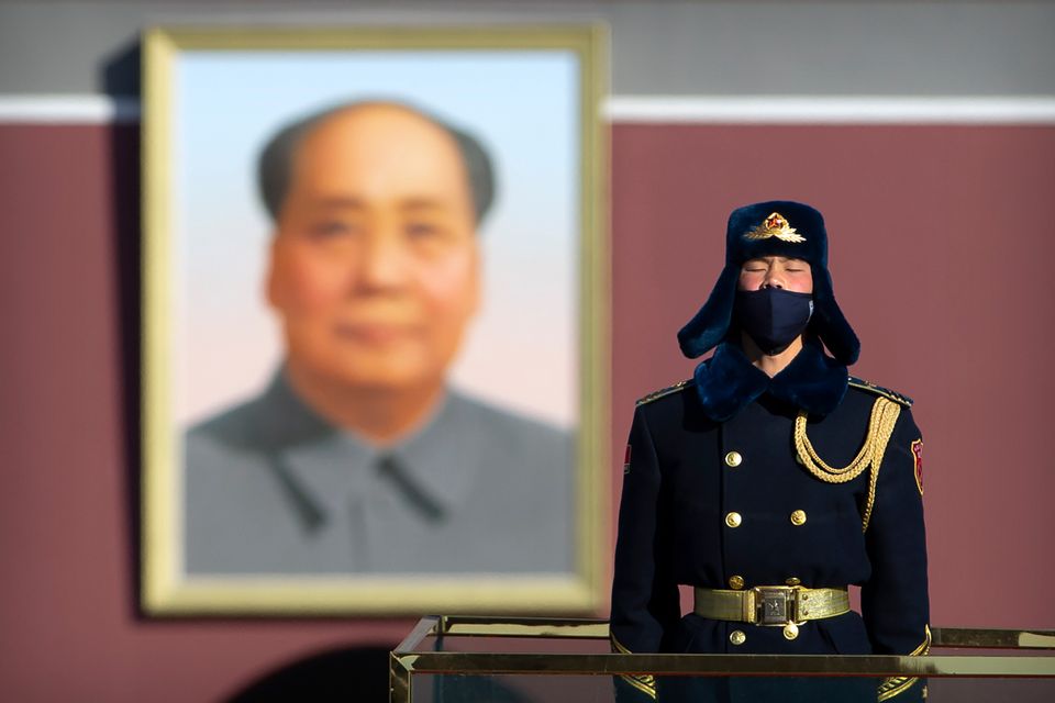 A member of a Chinese honour guard wears a face mask as he stands guard on Tiananmen Square in Beijing, Tuesday, Feb. 4.