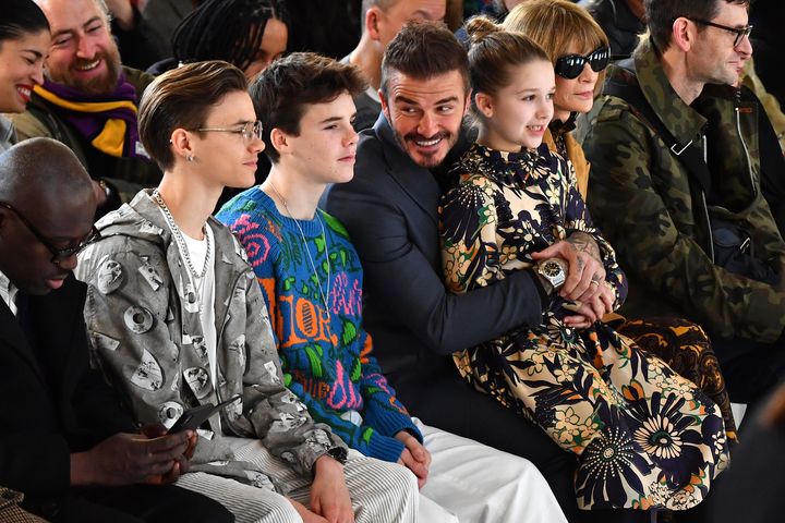The Beckham family – including Harper on David's lap – at her latest London show
