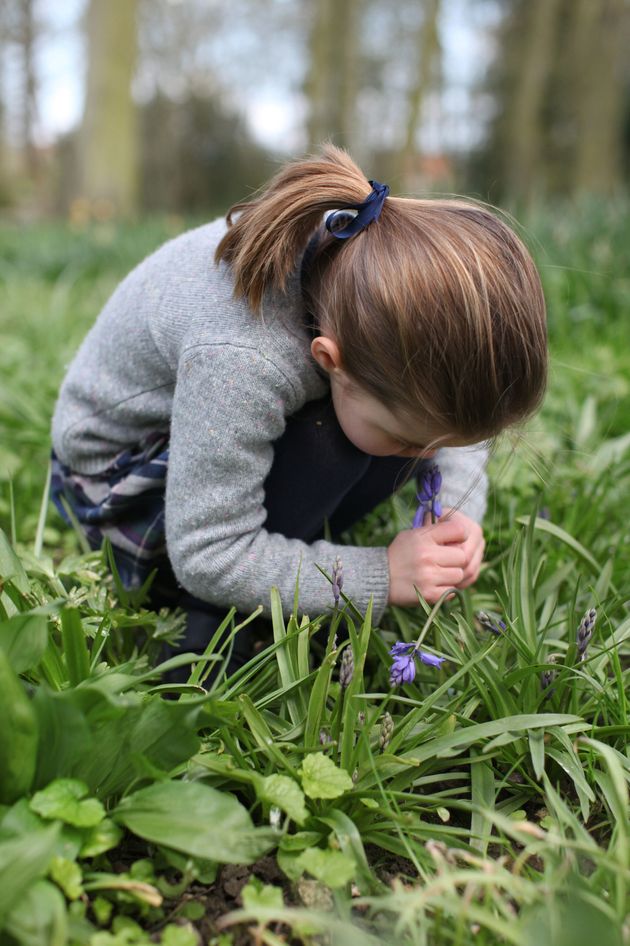 In the podcast, the Duchess said she treasures this photo of Charlotte smelling a bluebell. 