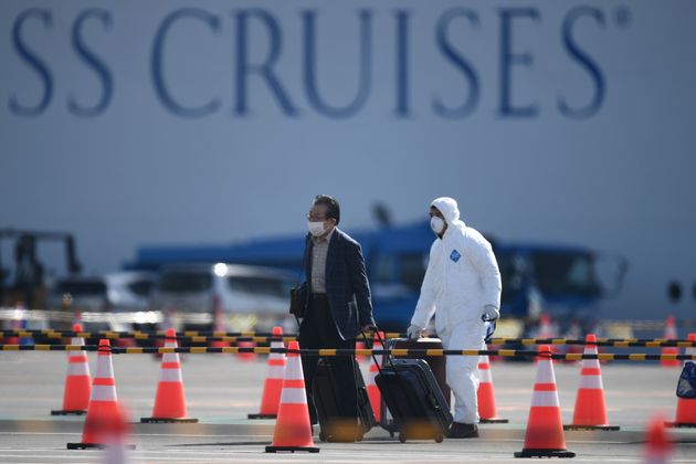 A passenger disembarks from the Diamond Princess cruise ship 