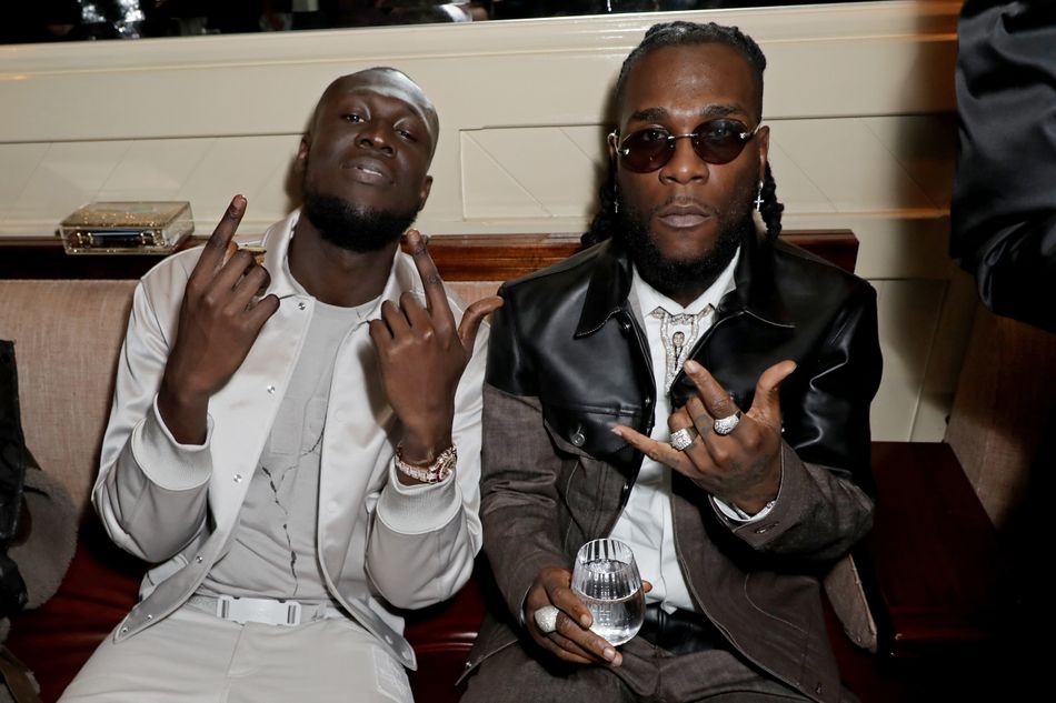 Meanwhile at Warner, Stormzy and Burnaboy reunited following their moment on stage together earlier in the evening