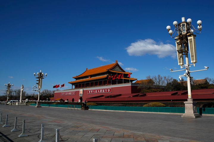 A Chinese official on Wednesday said it expelled the journalists because the Journal refused demands to apologize and "hold the persons involved accountable.” Beijing's Tiananmen Gate is seen.