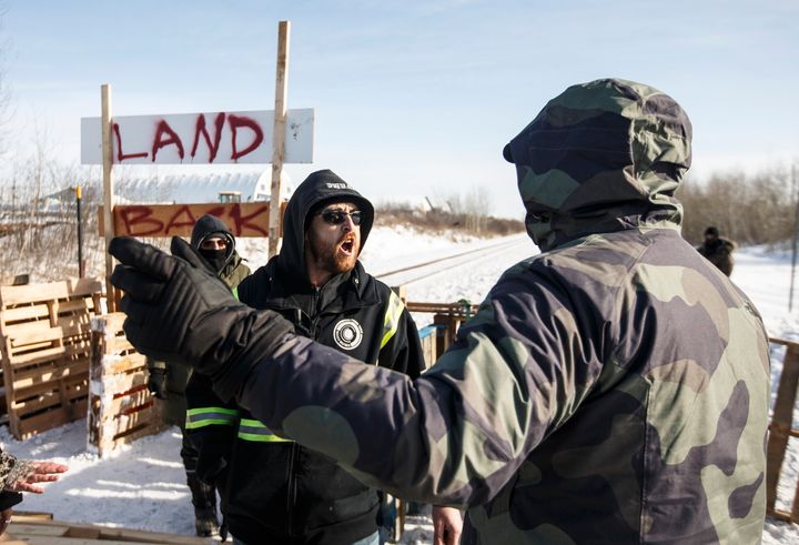 A counter-protester argues with supporters of the Wet'suwet'en hereditary chiefs near Edmonton on Wednesday.