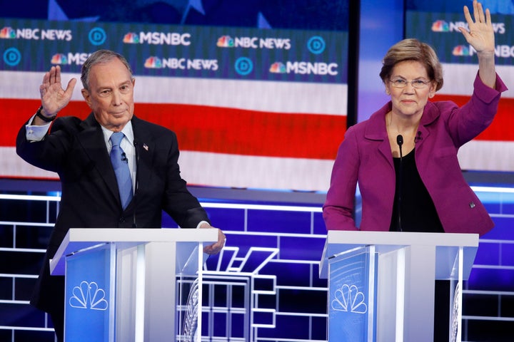Former New York Mayor Mike Bloomberg and Sen. Elizabeth Warren (D-Mass.) try to get in their time at the Democratic presidential primary debate Wednesday in Las Vegas.