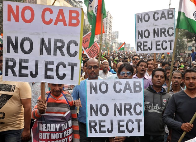 Demonstrators attend a protest march against the National Register of Citizens (NRC) and a new citizenship...