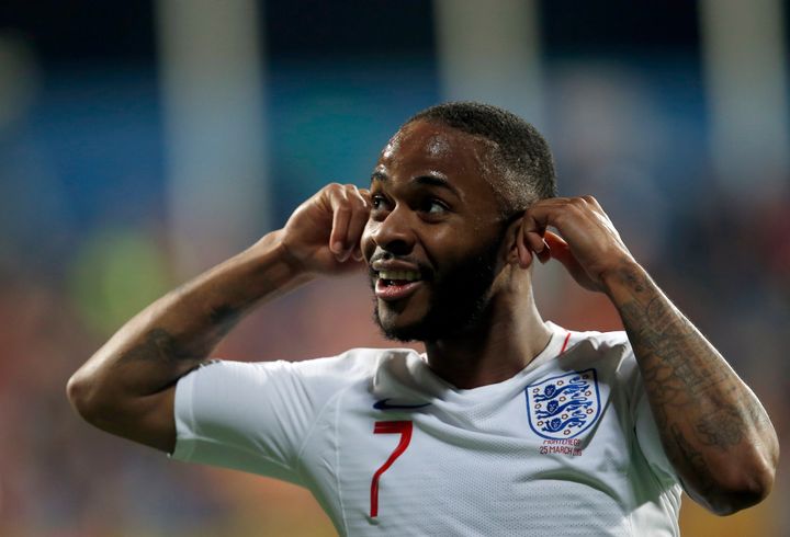England's Raheem Sterling celebrates scoring his side's fifth goal after hearing racist chants during their Euro 2020 group A qualifying match against Montenegro