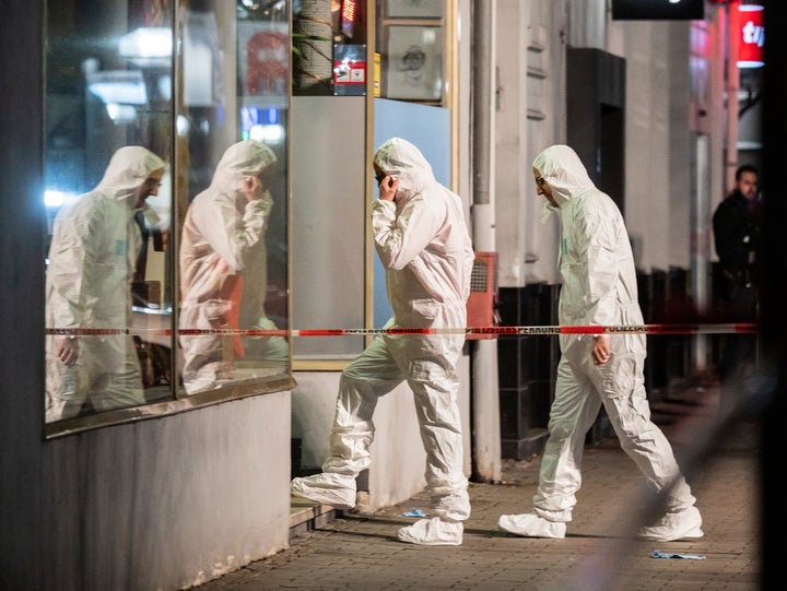 Forensics enter a building at the scene after a shooting in central Hanau, Germany, on Thursday.