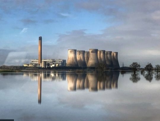 Eggborough power station in North Yorkshire is reflected in floodwater from the River Aire.