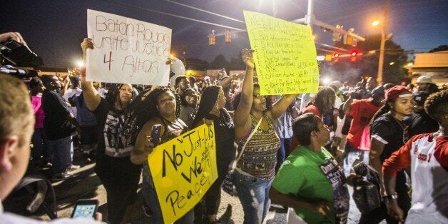 BATON ROUGE, LA -JULY 06: Protesters march to the convenience store where Alton Sterling was shot and killed, July 6, 2016 in Baton Rouge, Louisiana. Sterling was shot by a police officer in front of the Triple S Food Mart in Baton Rouge on Tuesday, July 5, leading the Department of Justice to open a civil rights investigation. (Photo by Mark Wallheiser/Getty Images)