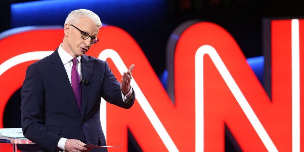 FLINT, MI - MARCH 06: Debate moderator Anderson Cooper looks during the CNN Democratic Presidential Primary Debate between Democratic presidential candidate Hillary Clinton and candidate Senator Bernie Sanders (D-VT) at the Whiting Auditorium at the Cultural Center Campus on March 6, 2016 in Flint, Michigan. Voters in Michigan will go to the polls March 8 for the state's primary. (Photo by Scott Olson/Getty Images)