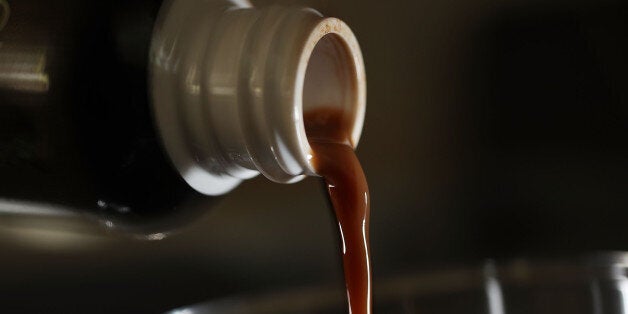 MIAMI, FL - MAY 10: In this photo illustration, a liquid form of the herbal supplement Kratom is poured from a bottle on May 10, 2016 in Miami, Florida. The herbal supplement is a psychoactive drug derived from the leaves of the kratom plant and it's been reported that people are using the supplement to get high and some states are banning the supplement. (Photo by Joe Raedle/Getty Images)