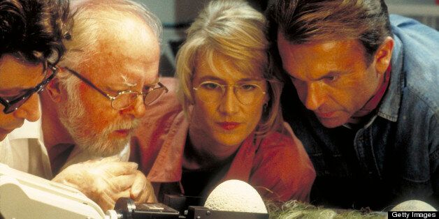 From left to right, actors Jeff Goldblum as Dr. Ian Malcolm, Richard Attenborough as John Hammond, Laura Dern as Dr. Ellie Sattler and Sam Neill as Dr. Alan Grant, watching a robotic arm handle the dinosaur eggs in a scene from the film 'Jurassic Park', 1993. (Photo by Murray Close/Getty Images)