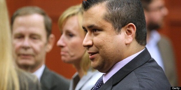 B583057987Z.1 SANFORD, FL - JULY 13: George Zimmerman leaves the courtroom a free man after being found not guilty, on the 25th day of his trial at the Seminole County Criminal Justice Center July 13, 2013 in Sanford, Florida. Zimmerman was charged with second-degree murder in the 2012 shooting death of Trayvon Martin. (Photo by Joe Burbank-Pool/Getty Images)