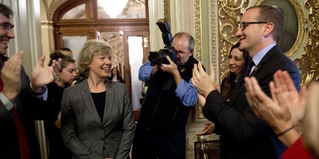 US Democratic Senator Tammy Baldwin of Wisconsin (2nd L), the first openly gay member of the Senate, greets supporters, inclu