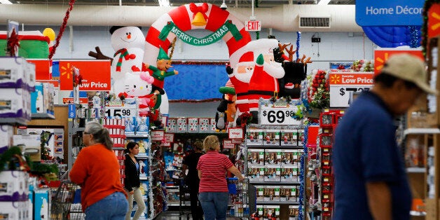 Customers shop at a Wal-Mart Stores Inc. location ahead of Black Friday in Los Angeles, California, U.S., on Tuesday, Nov. 26