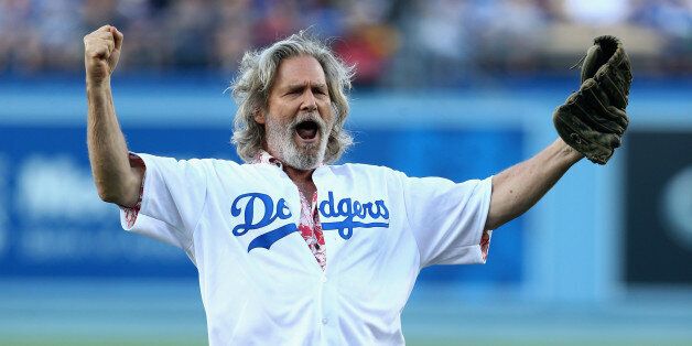 LOS ANGELES, CA - AUGUST 01: Actor Jeff Bridges reacts after throwing out the ceremonial first pitch prior to the start of the game between the Chicago Cubs and the Los Angeles Dodgers at Dodger Stadium on August 1, 2014 in Los Angeles, California. (Photo by Jeff Gross/Getty Images)