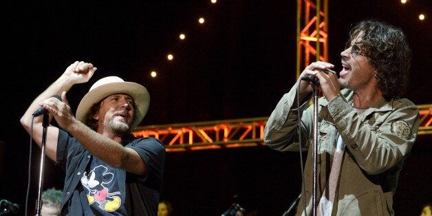 MOUNTAIN VIEW, CA - OCTOBER 26: Eddie Vedder (L) of Pearl Jam and Chris Cornell perform during the 28th annual Bridge School Benefit at Shoreline Amphitheatre on October 26, 2014 in Mountain View, California. (Photo by Tim Mosenfelder/Getty Images)