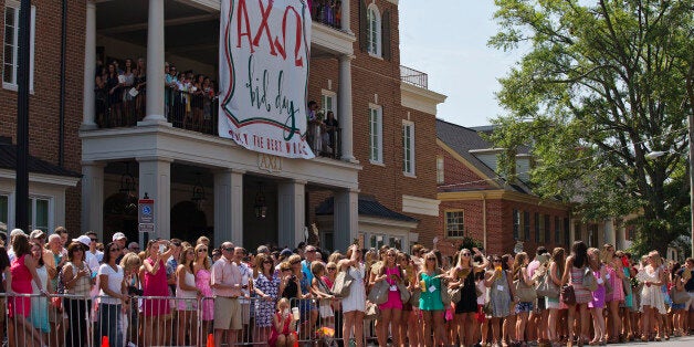 The University of Alabama's Alpha Chi Omega members, family and friends stand outside of the sorority house waiting on the newest members during Bid Day outside of BryantâDenny Stadium on Saturday, Aug. 16, 2014, in Tuscaloosa, Ala. (AP Photo/Brynn Anderson)