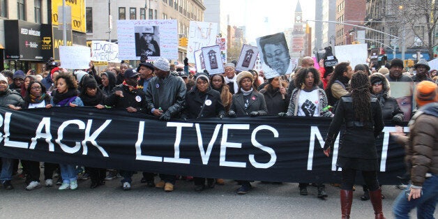 NEW YORK, NY - DECEMBER 13: Thousands of protestors converge on Manhattan's Washington Square Park to march through the Manhattan to protest the police violence on December 13, 2014 in New York, United States. Protestors shout slogans as Hands up, dont shoot, Black lives matter and I cant breathe during the march. (Photo by Mustafa Caglayan/Anadolu Agency/Getty Images)