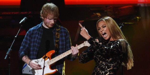 Beyonce, right, performs with Ed Sheeran during &quot;Stevie Wonder: Songs in the Key of Life - An All-Star Grammy Salute,&quot; at the Nokia Theatre L.A. Live on Tuesday, Feb. 10, 2015, in Los Angeles. (Photo by Chris Pizzello/Invision/AP)