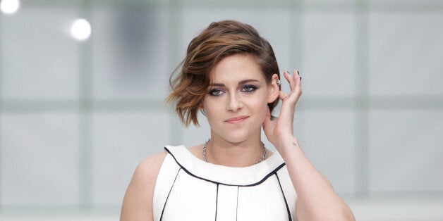 Actress Kristen Stewart poses for photographers as she arrives for Chanel 's Spring-Summer 2015 Haute Couture fashion collection, presented in Paris, France, Tuesday, Jan. 27, 2015. (AP Photo/Thibault Camus)