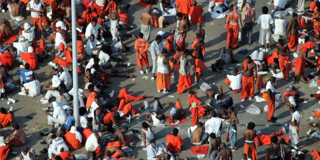 Orleans Parish prisoners are evacuated from the floodwaters of Hurricane Katrina Wednesday, Aug. 31, 2005 in New Orleans. (AP Photo/David J. Phillip)