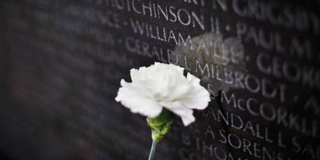 A white carnation is seen at the Vietnam Memorial on the National Mall in Washington, Monday, Nov. 9, 2015. Wednesday, Nov. 11 is Veterans Day, to honor those who served in the U.S. armed forces (AP Photo/Pablo Martinez Monsivais)